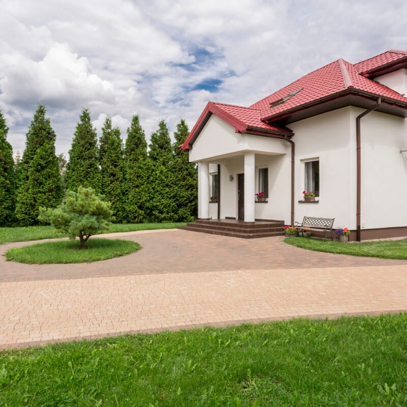 Big white house with patio and big garden